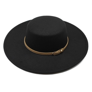 Detail of black wool felt boater hat with a light brown leather band and gold buckle