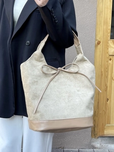 Beige faux suede tote bag for women with decorative bow and leather拼接 detail