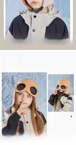 Close-up of winter hat with integrated goggles and warm white plush lining for kids
