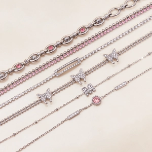 Silver stainless steel bracelet set with pink cubic zirconia and butterfly charms