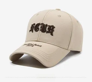 Detail of beige baseball cap with brown Gothic ICUR embroidery and Yachting Spirit text
