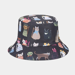 Close-up of colorful cartoon cat patterns printed on black cotton bucket hat fabric