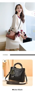 Detail view of vintage leather handbag with round handle and adjustable shoulder strap