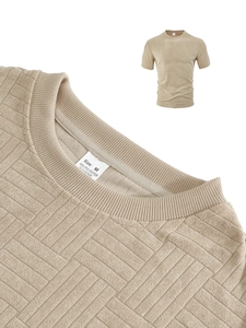 Detail of beige waffle knit polo shirt showing fabric texture and neckline stitching