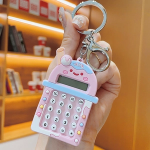 Close-up of pink milk tea cup mini calculator keychain with metal lobster clasp