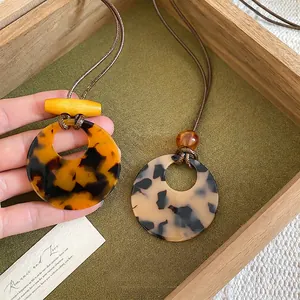 Retro resin circle pendant necklace with wooden beads on adjustable wax cord chain