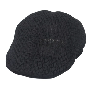 Close-up of the breathable black mesh fabric and textured knit of the flat cap hat