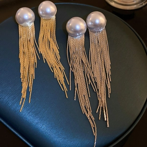 Elegant long fringe tassel earrings with large faux pearls in gold and silver metal finishes