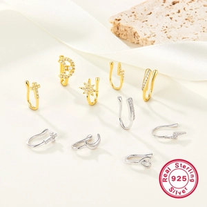 Detailed view of 925 sterling silver star and moon nose rings with cubic zirconia