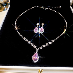 Exquisite pink teardrop pendant necklace and earrings set in a white jewelry gift box