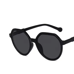 Chic black polygonal sunglasses with dark lenses and geometric frame for women
