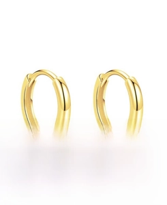 Close-up of polished S925 sterling silver hoop earrings with gold plating and clasp detail