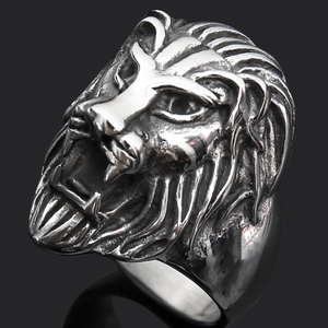 Macro detail of vintage silver lion head ring with antique finish and steel texture