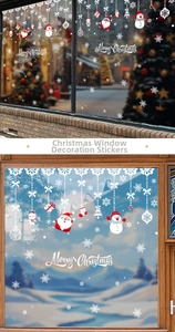 Detail of Christmas window clings featuring Santa, snowman and Merry Christmas lettering