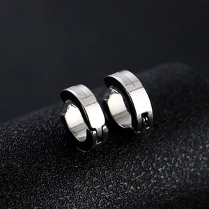 Polished silver metal ear cuffs with THG engraving in a minimalist U-shaped industrial design