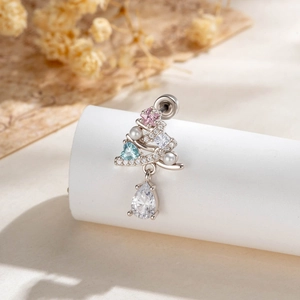 Christmas tree belly ring with zirconia heart and waterdrop stone on display