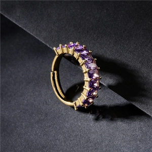 Adjustable gold ring featuring purple square-cut zircons in a luxurious pave setting