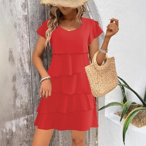 Vibrant red tiered summer dress with ruffle sleeves and round neck on a female model