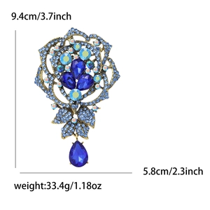 Detailed view of rhinestone rose brooch with dimensions 9.4cm by 5.8cm and weight info