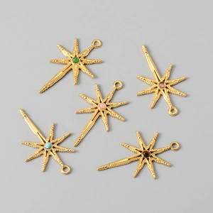 Detail of five-piece gold octagonal star charms set with colorful natural stones
