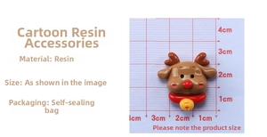 Detailed view of DIY resin Christmas reindeer charm with red nose and bell on grid mat