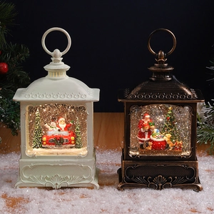 Vintage Christmas snow globe lanterns with Santa Claus and LED lights on wood desk