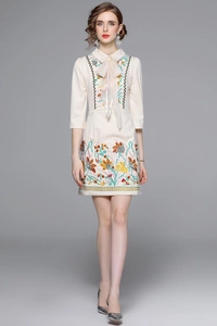 Elegant beige spring dress with intricate floral embroidery and mid-sleeves for women