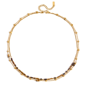 Detail of double-layer stainless steel gold chain with tiger eye beads and lobster clasp