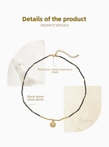 Detail of black spinel beaded necklace with golden stainless steel evil eye pendant