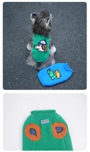 Close-up of contrast knit cuffs and Gentle Dog brand label on pet cartoon sweaters