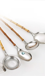 Detail view of 304 stainless steel kitchen utensils with natural bamboo handles