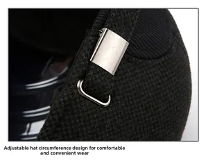 Detail of adjustable silver buckle on a black wool winter baseball cap for men