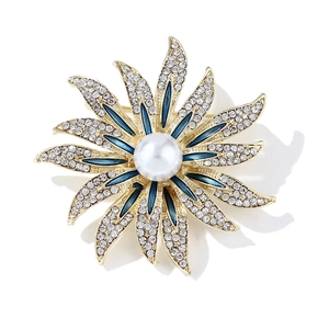 Elegant gold flower brooch with blue enamel petals, white pearls and sparkling rhinestones