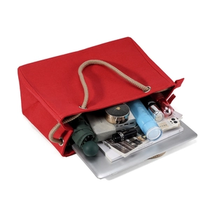 Large red canvas tote bag with rope handles showing spacious interior and daily essentials
