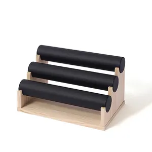 Three-tier wooden bamboo display stand with black velvet rolls for bracelets and watches
