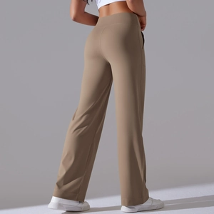 Detail view of khaki high-waisted yoga pants with functional side pockets and smooth seams