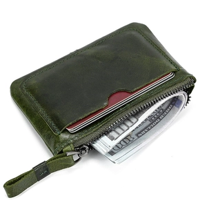 Close-up of green leather coin purse showing premium vintage texture and card slot