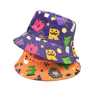 Double-sided Halloween bucket hats in purple and orange with spooky pumpkin and ghost prints