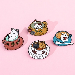 Detail of colorful cat coffee cup enamel pins featuring four unique cute animal designs