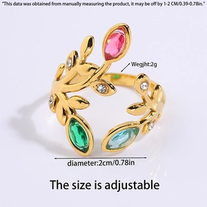 Detail of adjustable gold titanium ring with leaf design and colorful gemstones