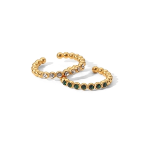 Close-up of gold beaded ear cuffs featuring white and green zircon stones on white background