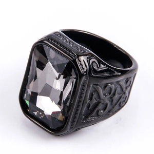 Vintage stainless steel ring featuring a square black gemstone and engraved patterns