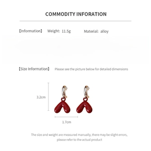 Detail view of red heart earrings showing dimensions 3.2cm by 1.7cm and alloy material