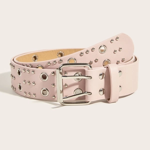 Close-up of pink faux leather belt with double grommets and silver metal rivets