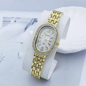 Elegant gold ladies quartz watch with rhinestone bezel and white oval dial on stand