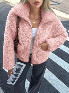 Elegant pink faux fur jacket with high collar and zipper closure for autumn street style