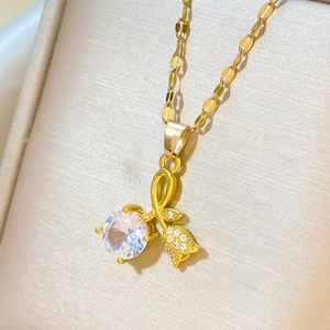 Luxurious gold tulip pendant necklace with rose zircon and pavé diamonds on silk background