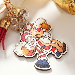 Christmas keychain with Santa Claus pendant, red tassel and bead bottle charm on white