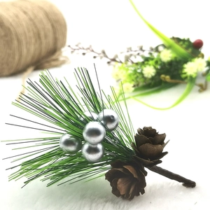 Artificial Christmas pine needles with silver berries and pine cones for DIY decor