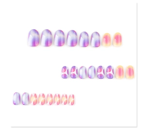 Detail of short oval press-on nails with purple-yellow gradient and white dot patterns